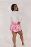Model showing pink boxer shorts with a pink and white bow pattern.