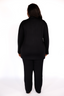 Woman wearing black luxury pajamas on a white background