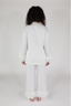 A woman modeling a white feather long sleeve and cropped pant pajama set with detachable feather cuffs on the wrists and ankles.