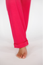 Bright pink pants on a white background