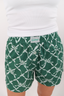 Green boxer short with geometric bow pattern.