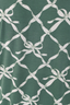 Green swatch with geometric bow pattern.