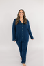 Model showing a navy blue matching pajama set with empire green piping.