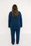 Model showing the back of the navy matching pajama set with empire green piping.