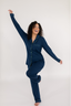Model showing matching navy blue pajama set with empire green piping.