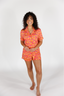 Woman wearing a colorful outfit on a white background