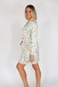 Woman wearing a floral dress on a white background