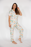 Woman wearing a fruit pajama set on a white background
