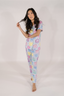 Model showing light blue matching pajama set with multicolored cake print.