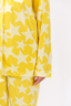 Yellow pajama set with star pattern on a white background