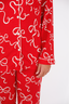 Red pajama set with white bow pattern on a white background