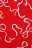 White bows pattern on a red background