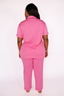 Person wearing a pink pajama set on a white background