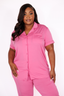 Woman wearing a pink pajama set on a white background