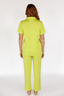 Woman wearing a lime punch green luxury pajama set on a white background