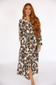 Woman wearing a luxury leopard print long robe with lime punch piping on a white background