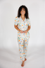 Woman wearing a fruit pajama set on a white background