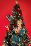 Woman in festive pajamas standing next to a decorated Christmas tree on a red background